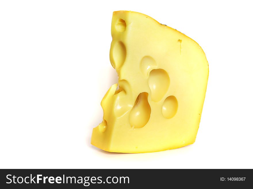 On the photo:Piece of cheese on white background