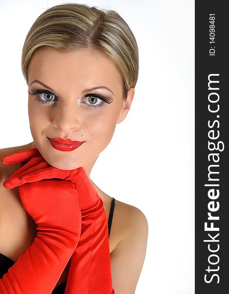 Young elegant beauty female face with red shiny lips and black eye makeup. colse-up.