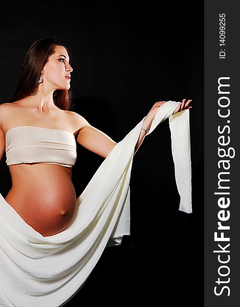 Pretty Pregnant Girl In A White Fabric