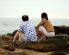 Couple Watching The Waves Royalty Free Stock Photography Couple Watching The Waves Royalty Free Stock Photography