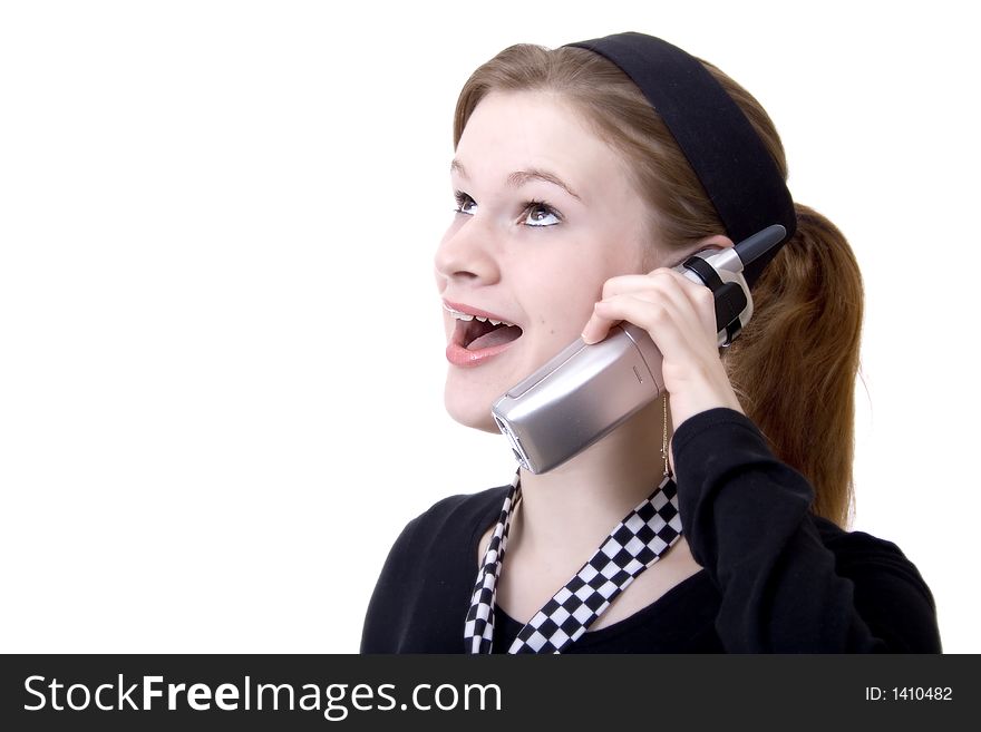Attractive teen smiling and talking on the phone. Attractive teen smiling and talking on the phone.