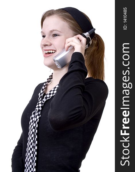 Attractive teen smiling and talking on the phone. Attractive teen smiling and talking on the phone.