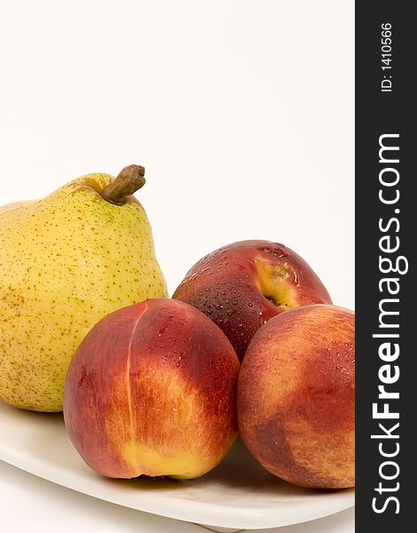 Pear and Nectarines on plain background, Studio shot.