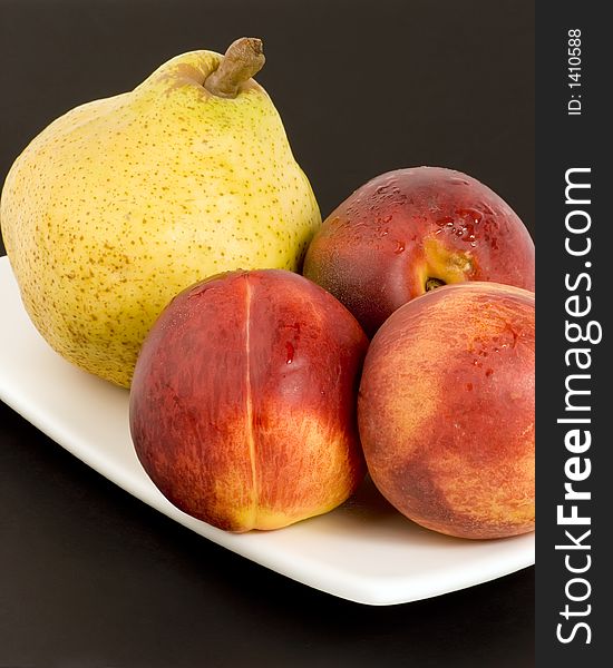 Pear and Nectarines on plain background, Studio shot.