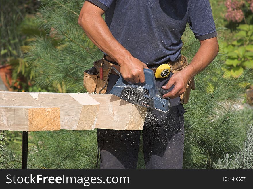 Working carpenter. Preparing elements for roof construction. Working carpenter. Preparing elements for roof construction