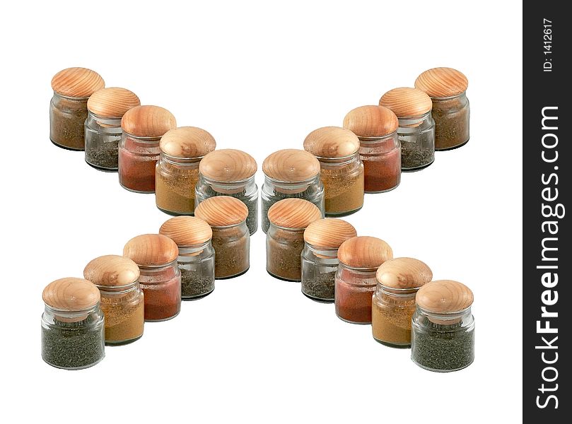 Jars with spices forming the letter X
