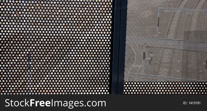 Melbourne railway tracks seen through a steel grille