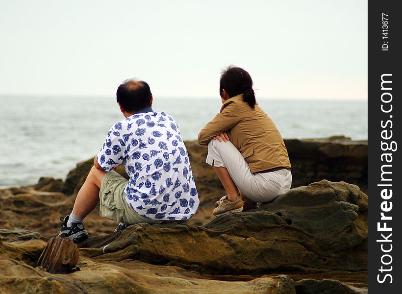 Couple watching the waves