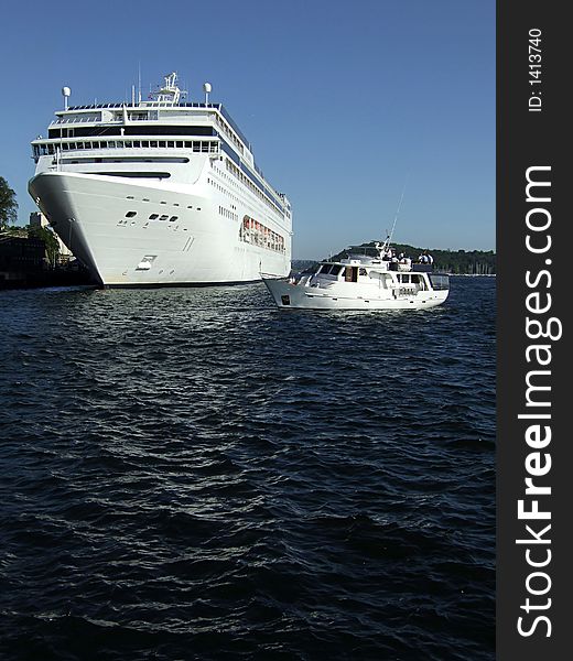 Picture of cruiser and yacht in harbor.