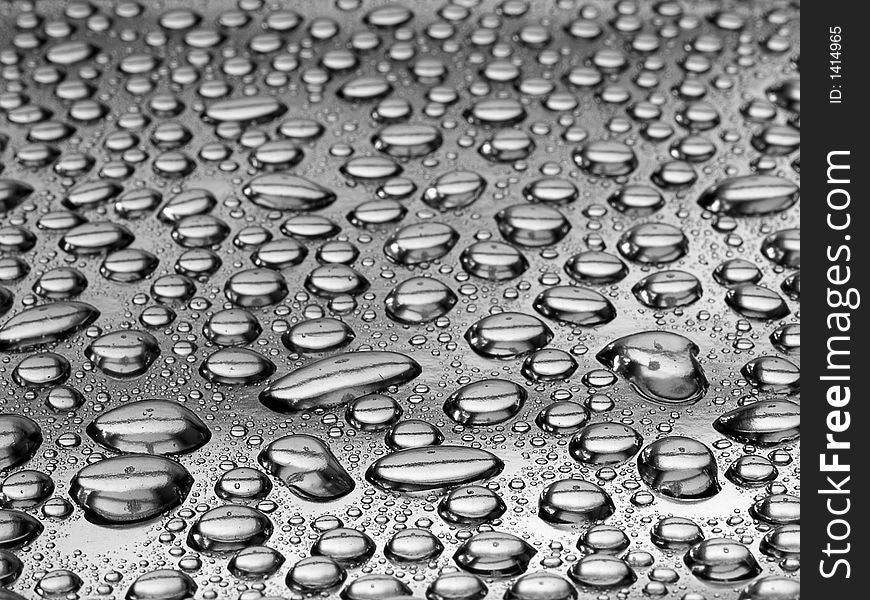 Water drops on a silver surface. Water drops on a silver surface