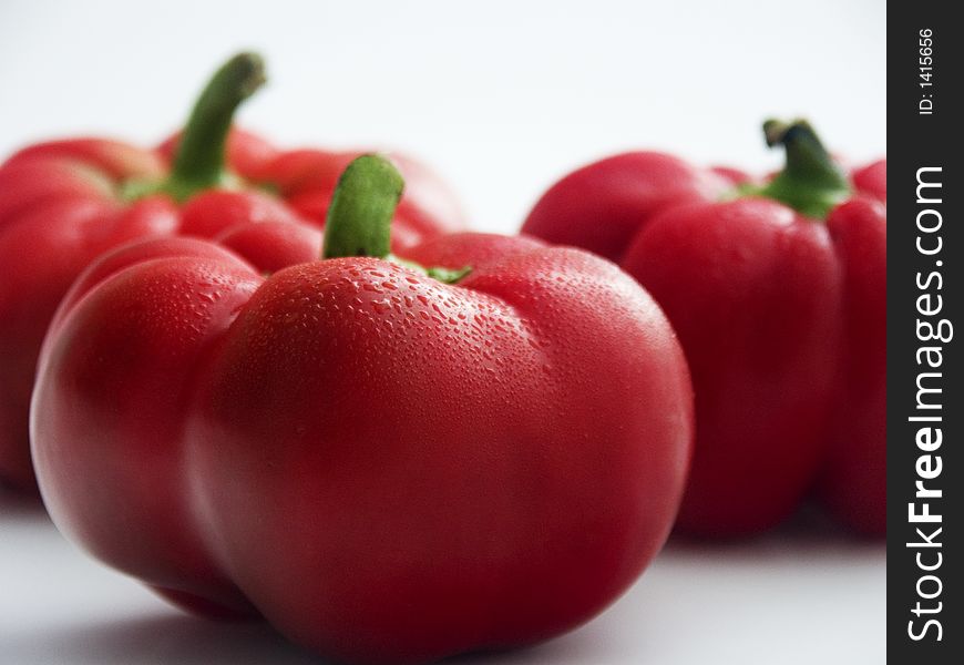 Three fresh red tomato peppers