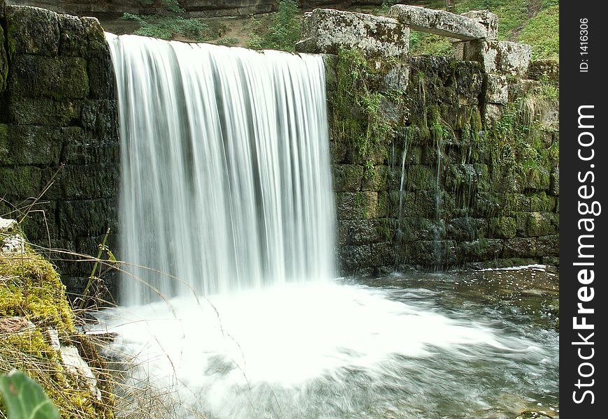 A waterfall of the river hÃ©risson in jura, france