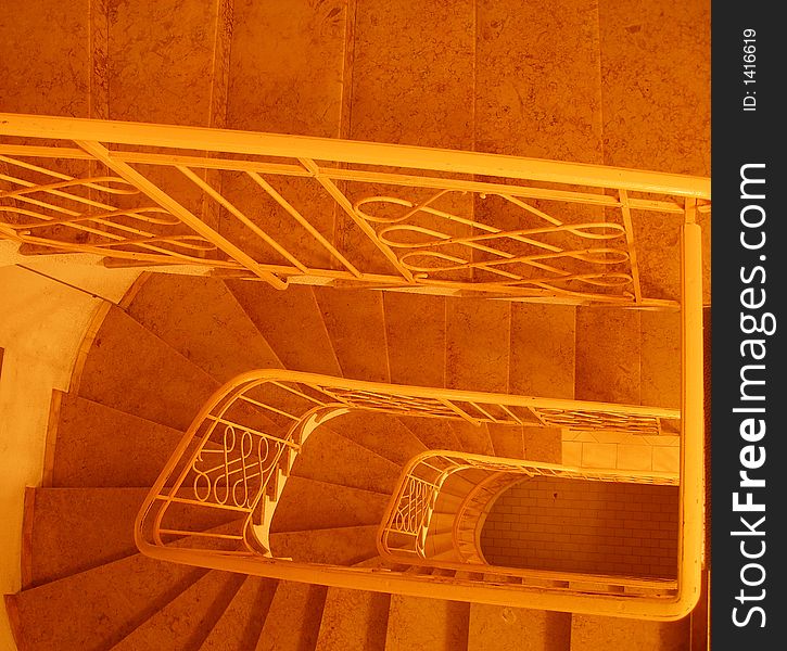 Staircase, orange level more steps, view from top