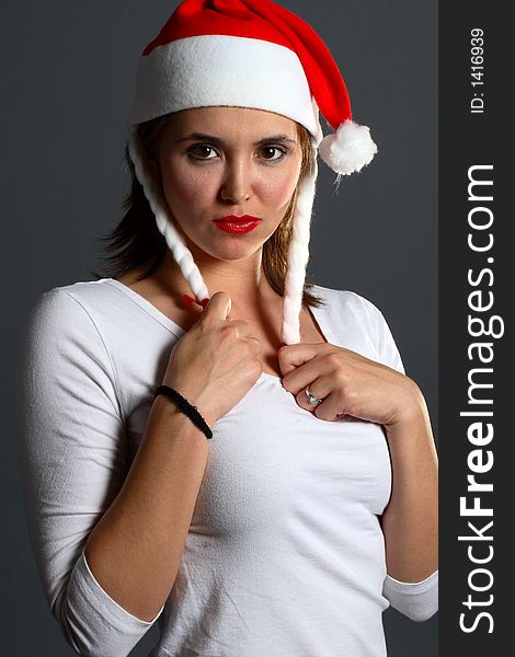 Brunette wearing a santa hat sexy portait. Brunette wearing a santa hat sexy portait