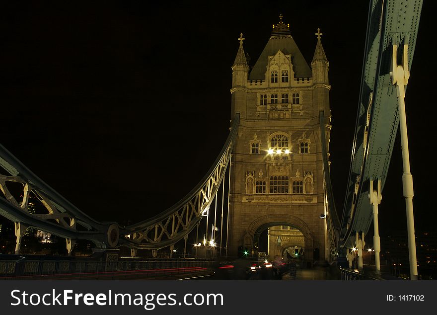 Tower bridge in London with traffic at night. Tower bridge in London with traffic at night