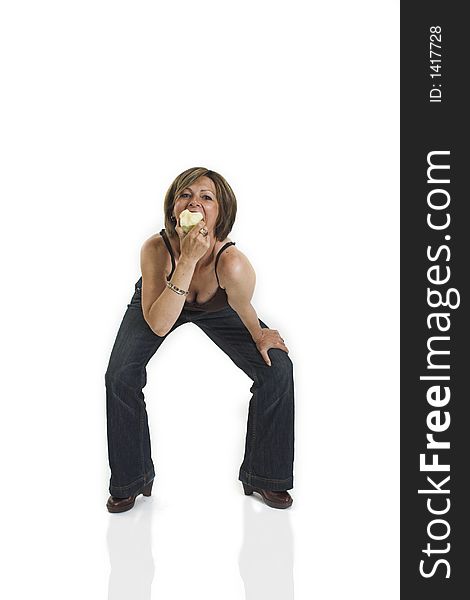 Woman eating an apple over white background