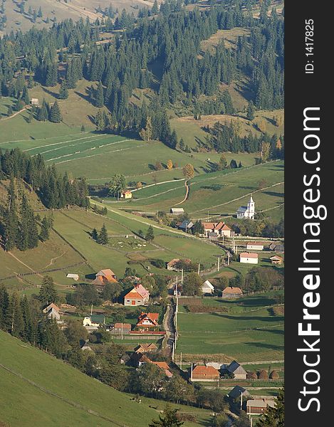 Small village in the valley in Transilvanian mountains