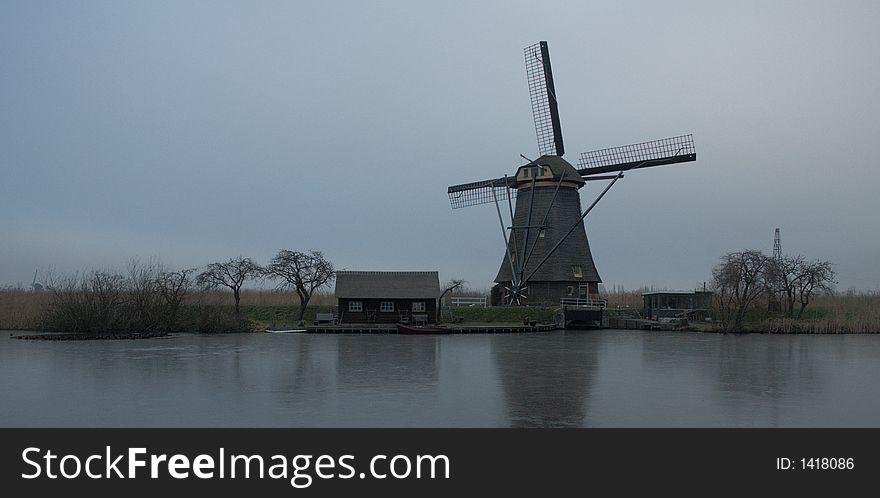 Historic dutch windmill at a location called Kinderdijk in winter when all is frozen. Historic dutch windmill at a location called Kinderdijk in winter when all is frozen.