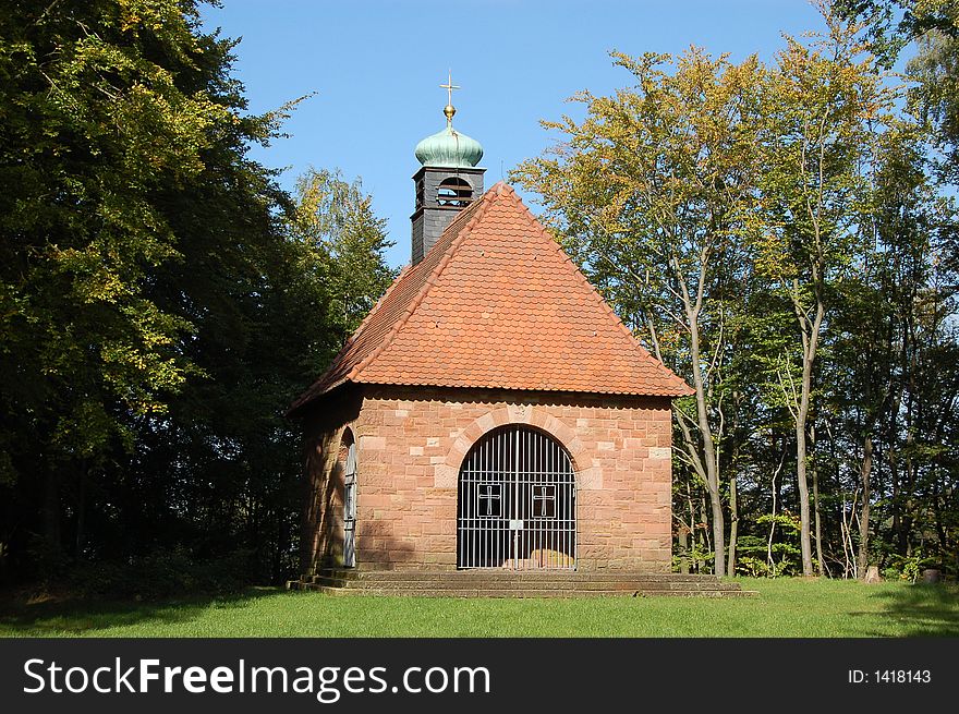 A view of the little German Chapel located in a clearing in the woods high up in the Axel area of Landstuhl, Germany. A view of the little German Chapel located in a clearing in the woods high up in the Axel area of Landstuhl, Germany