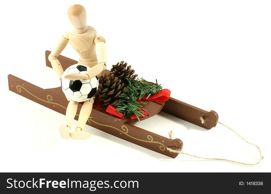 A simple, decorative, christmas sled with, soccer guy, pine cones, ribbon, and greenery. A simple, decorative, christmas sled with, soccer guy, pine cones, ribbon, and greenery