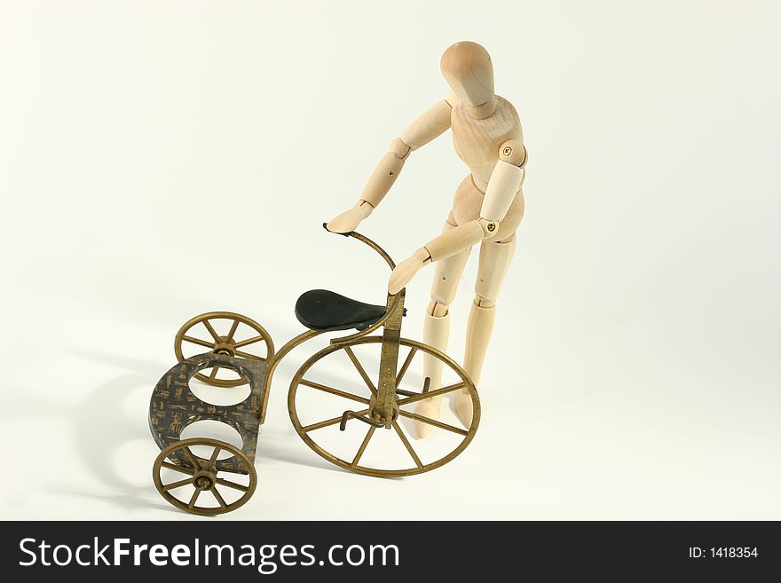 Child Or Man Inspecting A Tricycle