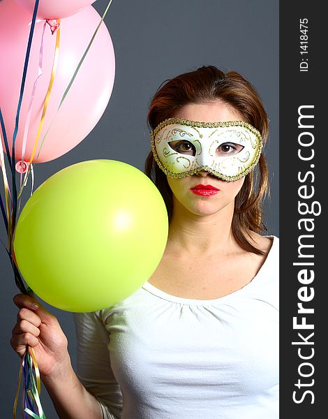 Brunette With Mask And Balloons