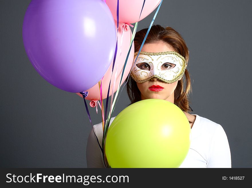 Brunette with mask and balloons