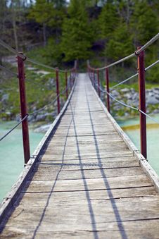 Hanging Wooden Bridge Over A River Stock Images