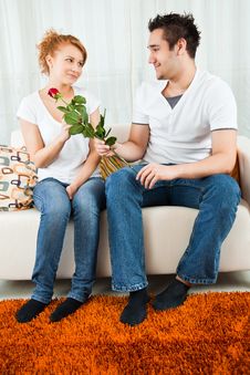 Young Boy Giving Red Rose To A Beauty, Young Girl Stock Photography