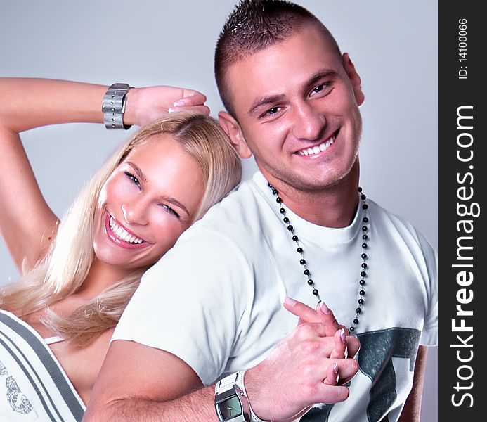 Young love couple smiling, studio shot