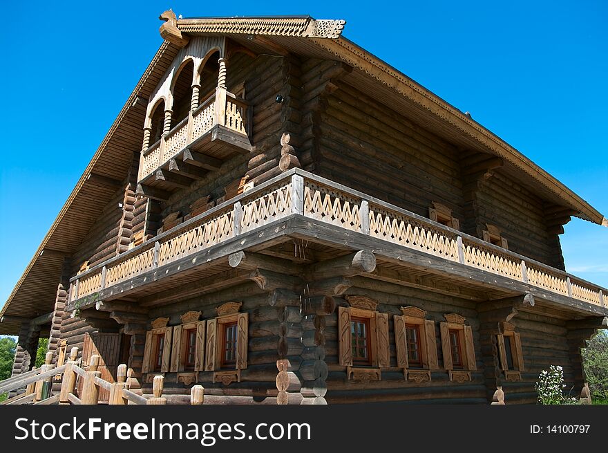 Wooden big house from timbers and windows on it. It is in a village in Russia. Sunny day