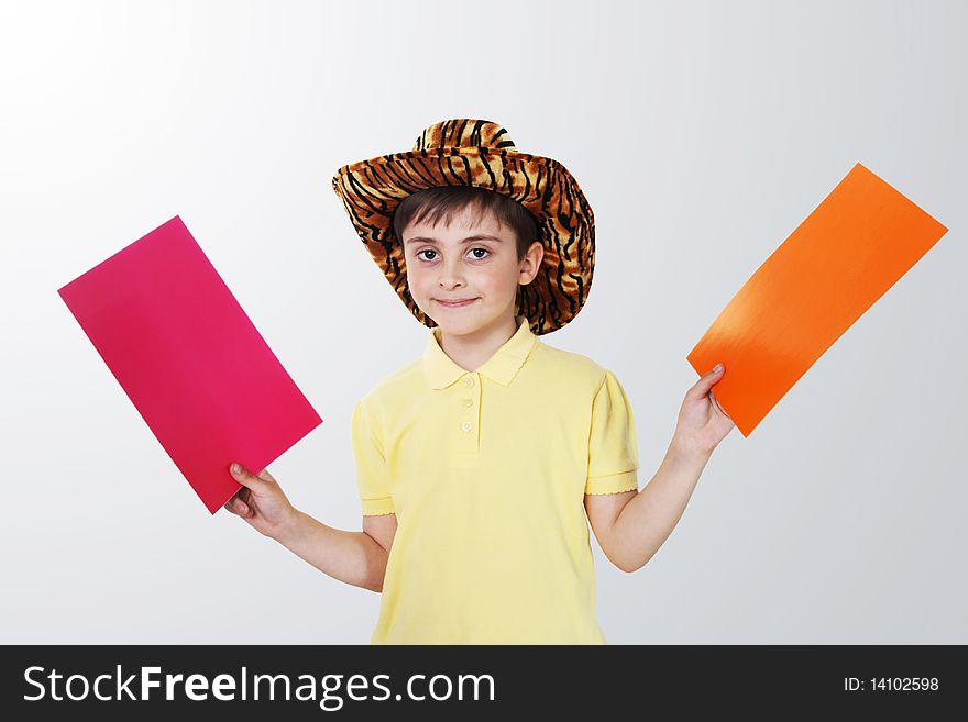 Boy With Colored Paper In His Hands