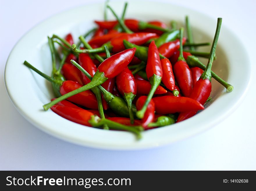 Red hot chillies in a small dish.