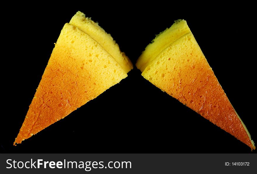 Two slices of light cheese cake
