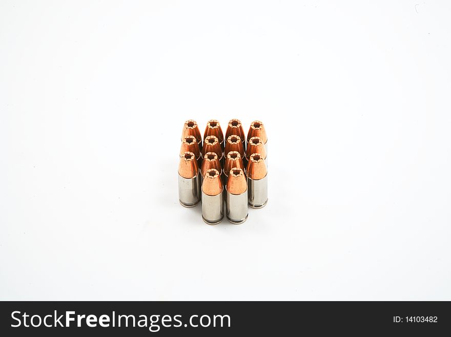 Group of 14 9 mm bullets isolated on white. Group of 14 9 mm bullets isolated on white
