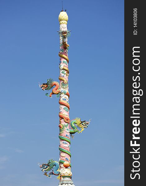 Four chinese dragon on the pole, blue sky. Four chinese dragon on the pole, blue sky