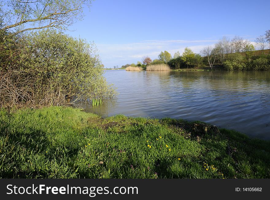 View on the picturesque artificial lake. View on the picturesque artificial lake