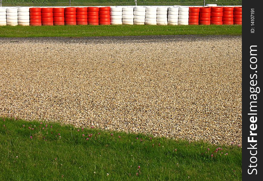 Run-off area with gravel trap and old tyres. Run-off area with gravel trap and old tyres