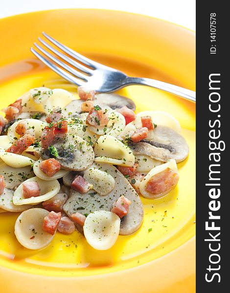 Pasta orecchiette with bacon and champignons. Pasta orecchiette with bacon and champignons