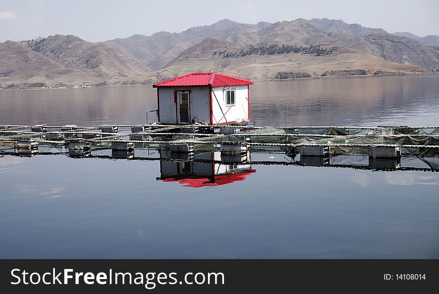 Fishermen with fish cage culture on the lake. Fishermen with fish cage culture on the lake.