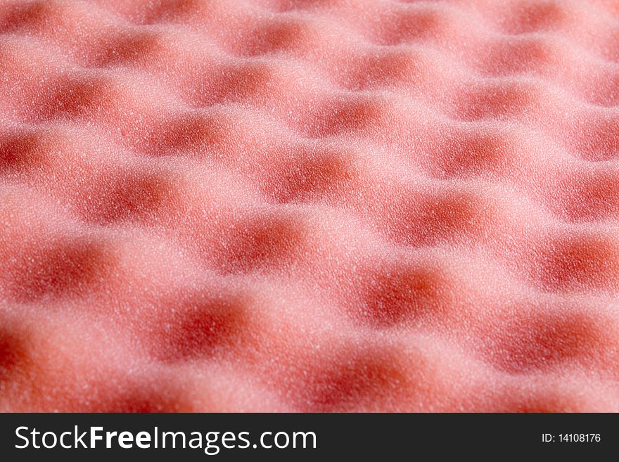 Foam rubber of pink color forms a relief. Foam rubber of pink color forms a relief