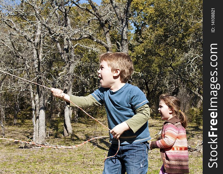 A boy and a girl showing surprise in outdoors. A boy and a girl showing surprise in outdoors