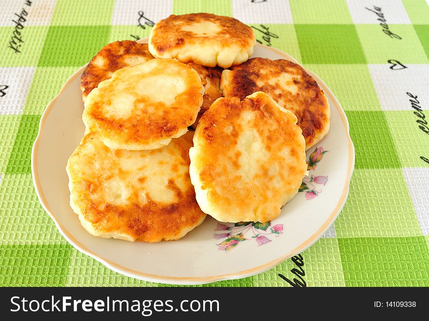 Image fried cheese fritters in a deep saucer