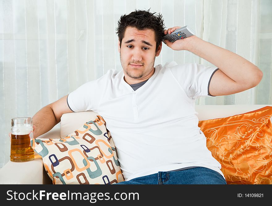 Young Boy Watching Football In The Television