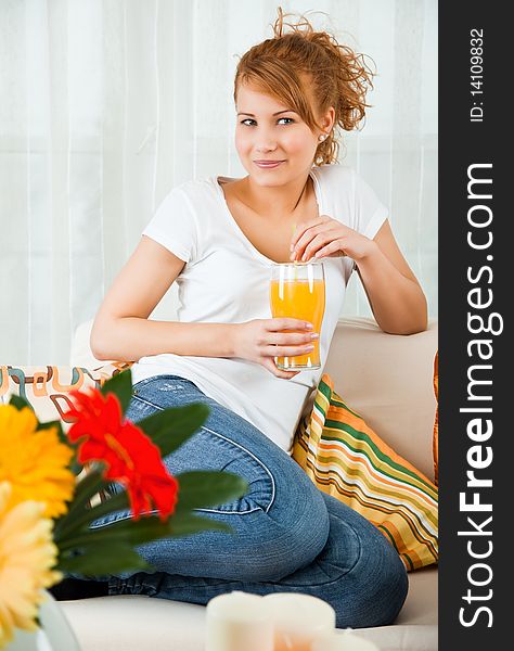 Beauty, young girl with a glass of orange juice