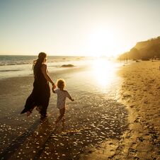 A Family Is Having Fun At The Seashore Stock Image