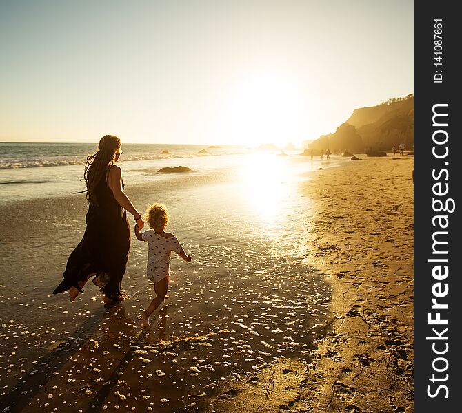 A Family Is Having Fun At The Seashore