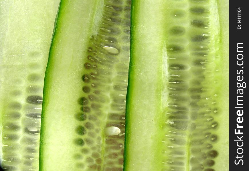 Detail photo of slices of cucumber texture background. Detail photo of slices of cucumber texture background