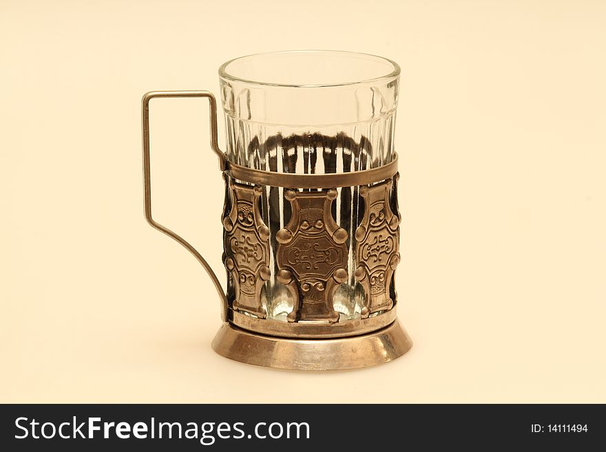 Cut-glass cup in a metal holder for tea. Cut-glass cup in a metal holder for tea