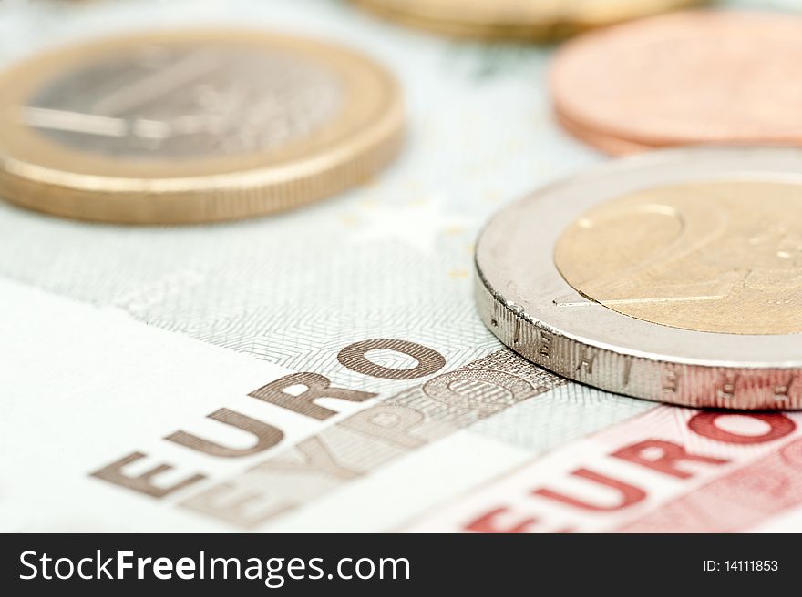 Close-up of euro coins and banknotes